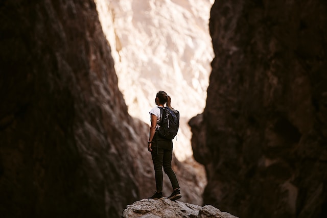 girl standing on a rock